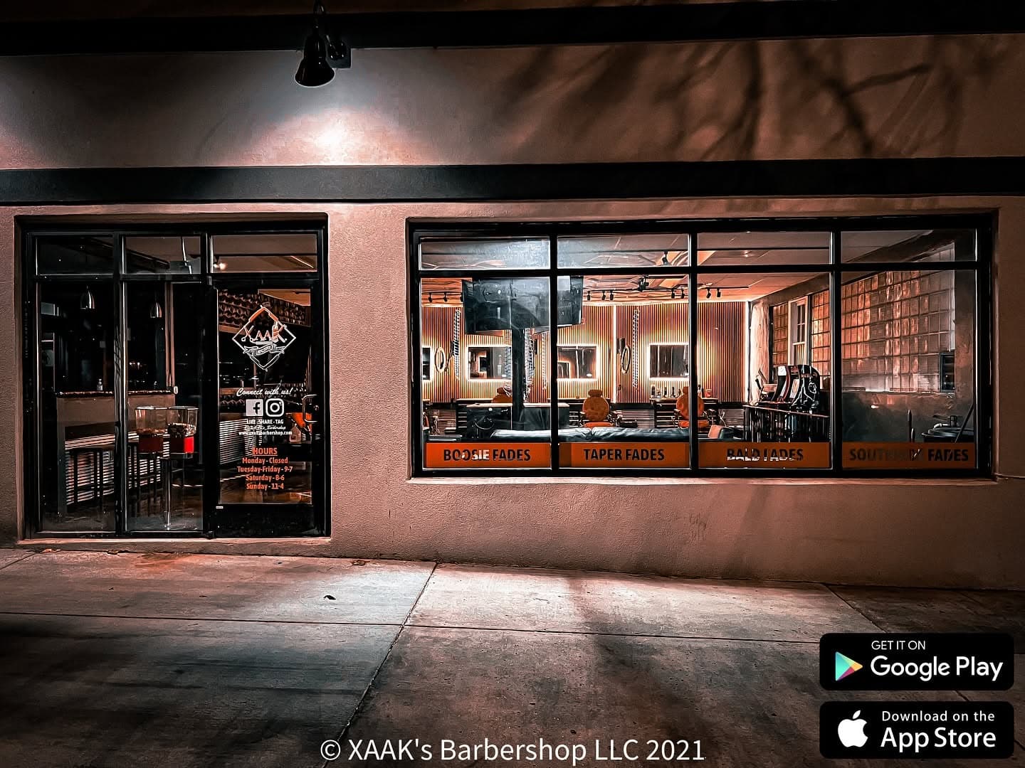 XAAK's Barbershop storefront at night in Downtown Loveland