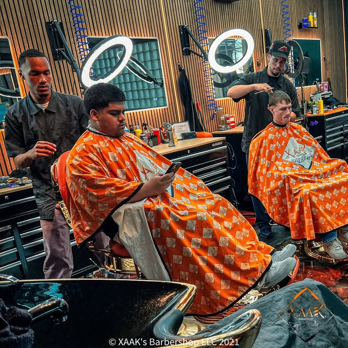 XAAK's barbers at work in the shop